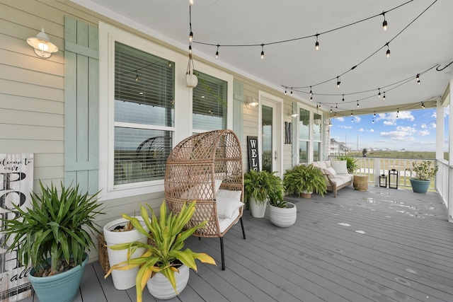 wooden terrace featuring covered porch