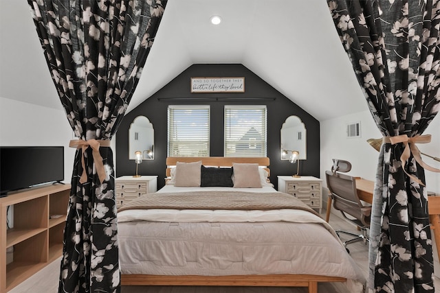 bedroom with lofted ceiling