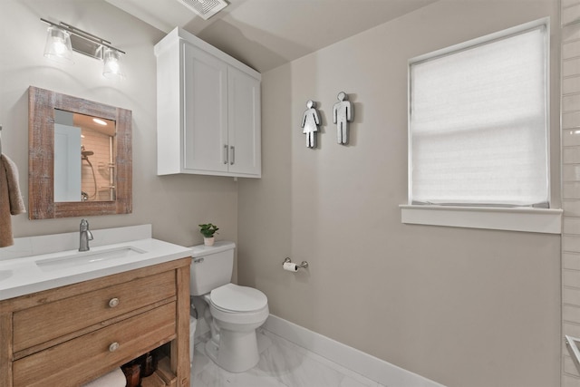 bathroom featuring vanity and toilet