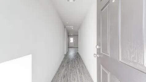 hall with light hardwood / wood-style floors