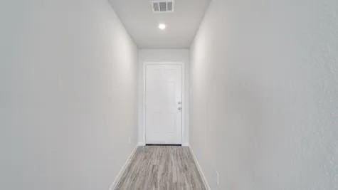 hallway with light wood-type flooring