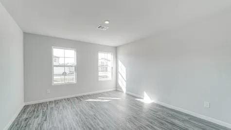 unfurnished room with hardwood / wood-style flooring