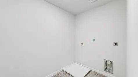 355 E Northpointe Ave, La Grange, TX 78945 - washroom with hookup for an electric dryer and baseboards