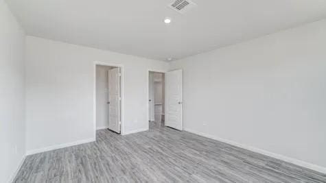 spare room featuring light hardwood / wood-style floors