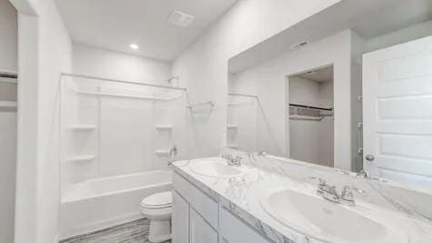 full bathroom with vanity, toilet, and bathtub / shower combination