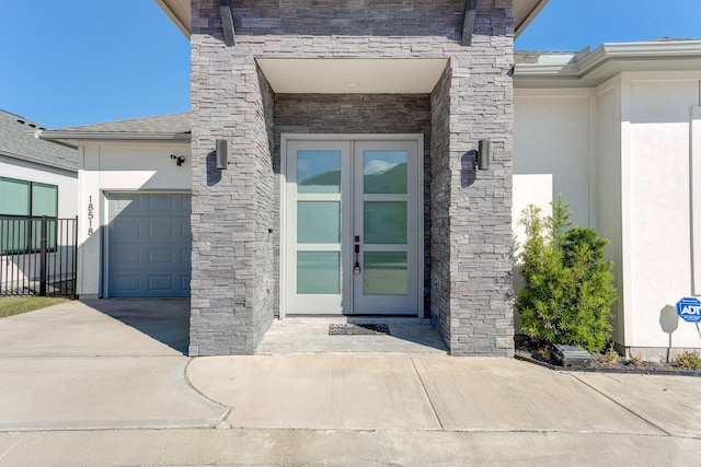 property entrance with french doors and a garage