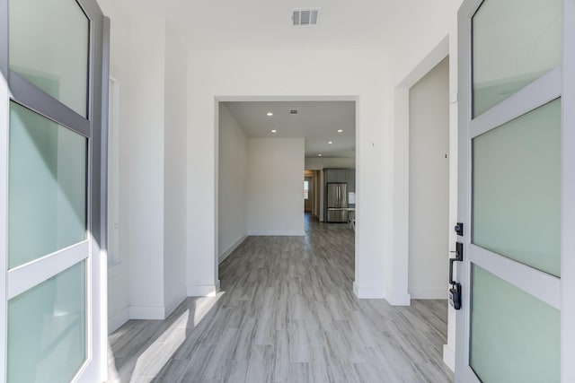 hall featuring light wood-type flooring