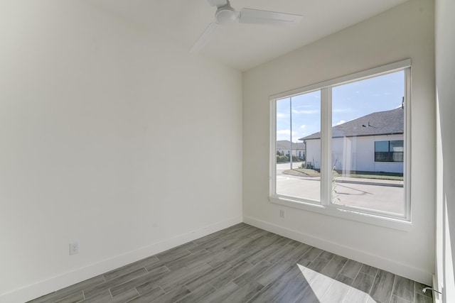 unfurnished room featuring hardwood / wood-style flooring and ceiling fan