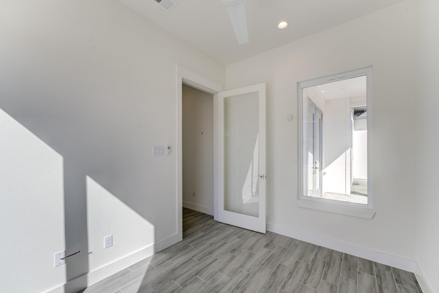 unfurnished room with light wood-type flooring