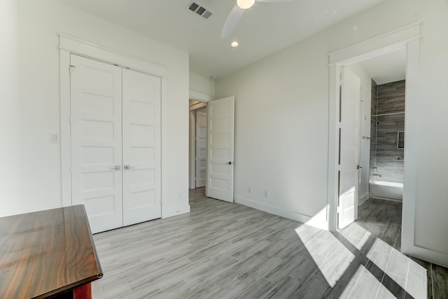 unfurnished bedroom featuring a closet, ceiling fan, and light hardwood / wood-style floors