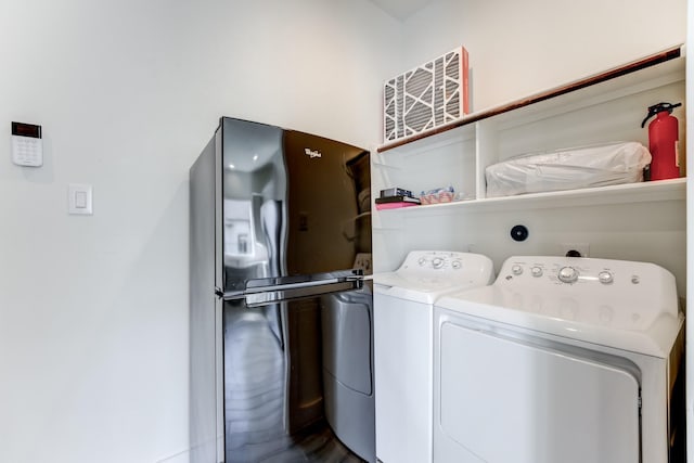 washroom with washer and clothes dryer