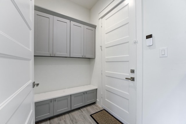 mudroom with light hardwood / wood-style flooring