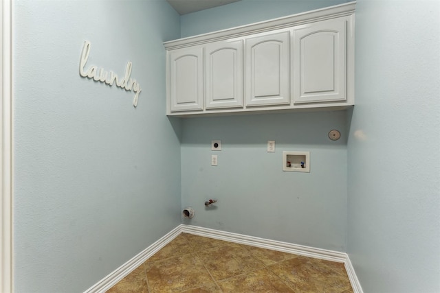 laundry area with hookup for an electric dryer, hookup for a gas dryer, cabinets, and hookup for a washing machine