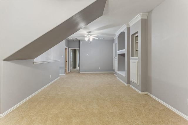 bonus room featuring light carpet and ceiling fan