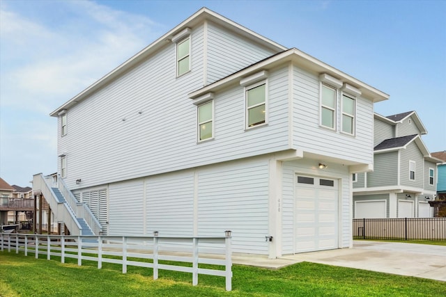 view of home's exterior with a yard and a garage