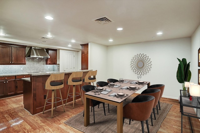 dining space featuring light hardwood / wood-style flooring