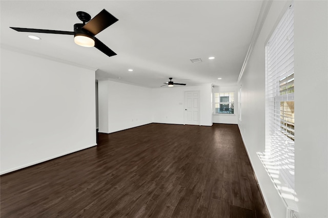 unfurnished living room with dark hardwood / wood-style floors, ceiling fan, and crown molding