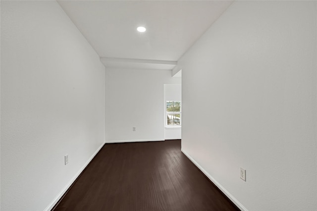 spare room featuring dark hardwood / wood-style flooring