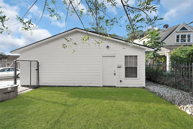 view of outdoor structure with a lawn