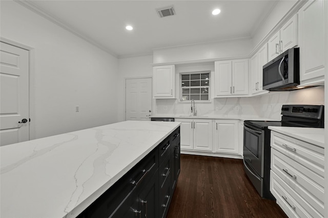 kitchen featuring black range with electric stovetop, crown molding, sink, dark hardwood / wood-style floors, and white cabinetry