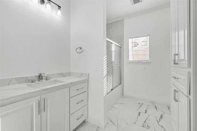 bathroom with vanity, shower / bath combination with glass door, and ornamental molding