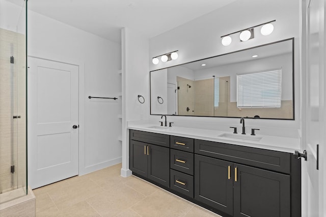 bathroom with tile patterned floors, vanity, and a shower with shower door