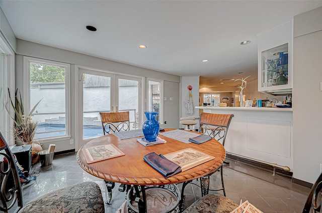 dining space with tile patterned floors