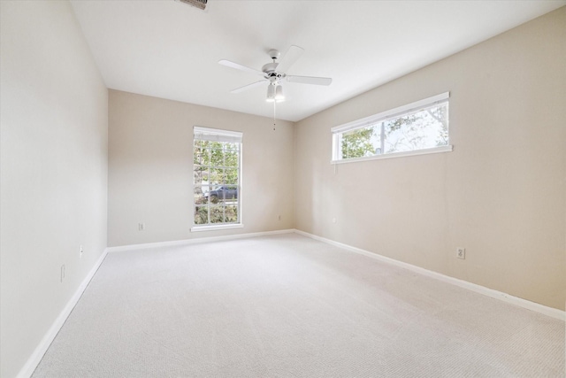 carpeted empty room with ceiling fan