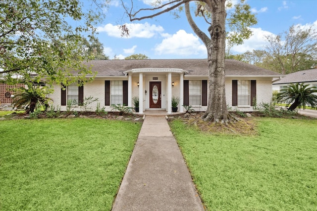 ranch-style home with a front yard