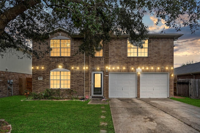 view of property featuring a yard and a garage