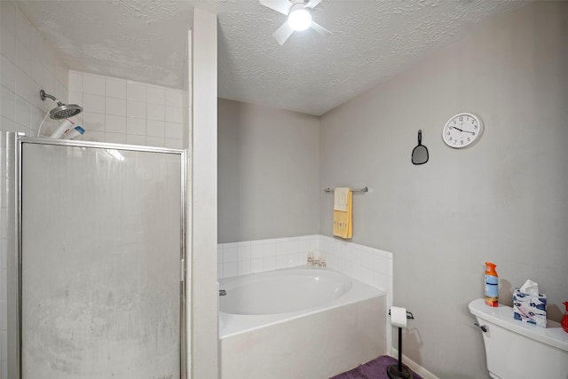 bathroom featuring a textured ceiling, toilet, and independent shower and bath