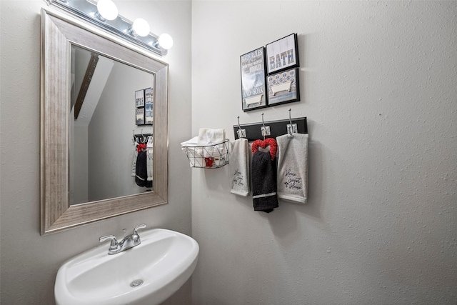 bathroom with sink and vaulted ceiling