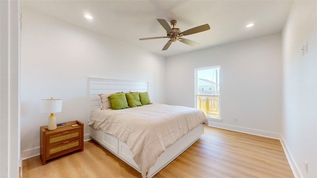 bedroom featuring ceiling fan and light hardwood / wood-style flooring