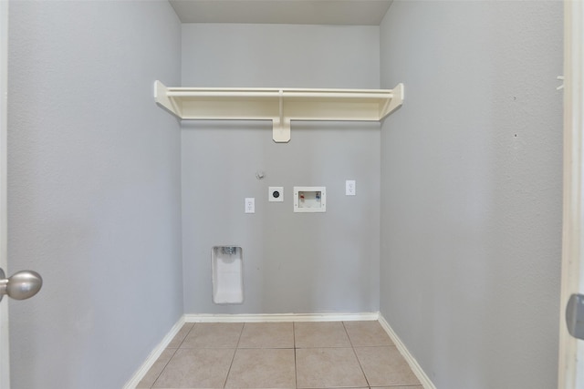 washroom with hookup for an electric dryer, gas dryer hookup, light tile patterned floors, and washer hookup