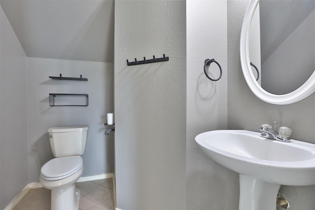 bathroom featuring tile patterned flooring and toilet