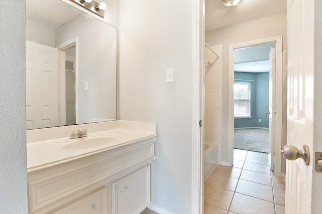 bathroom featuring shower / bathing tub combination, vanity, and tile patterned floors