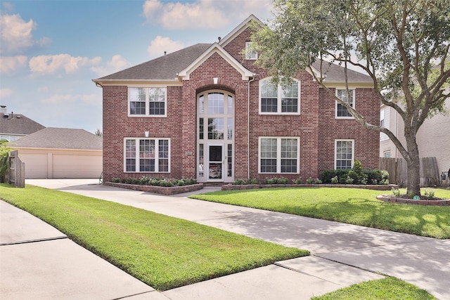 view of front facade with a front lawn and a garage