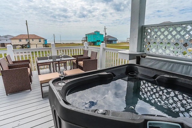 deck featuring a hot tub