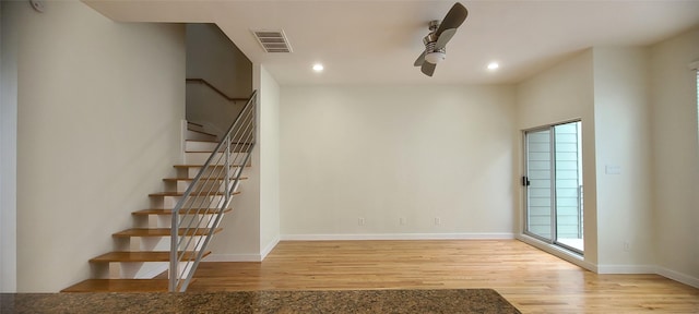 interior space featuring hardwood / wood-style flooring and ceiling fan