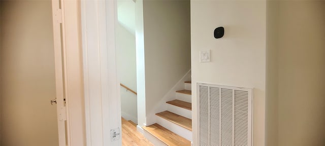 stairway featuring wood-type flooring