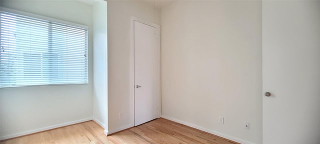 unfurnished bedroom featuring light wood-type flooring