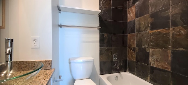 full bathroom with vanity, toilet, and tiled shower / bath combo