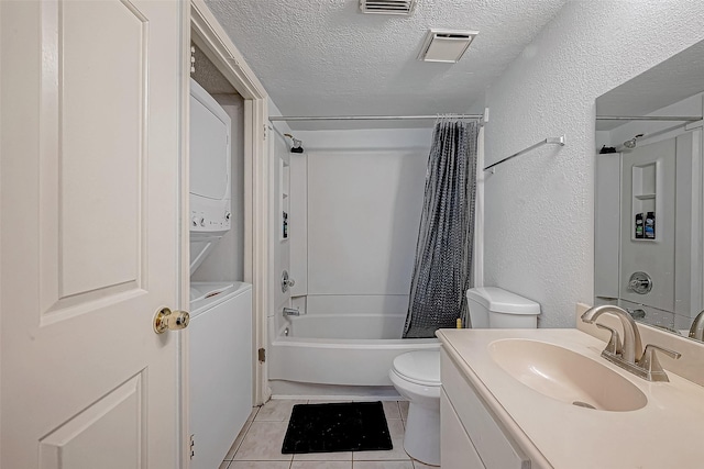 full bathroom featuring vanity, tile patterned flooring, shower / bathtub combination with curtain, a textured ceiling, and stacked washer / drying machine