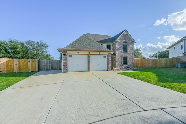 view of front of house featuring a garage and a front yard