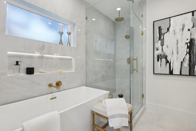 bathroom featuring tile patterned floors and plus walk in shower