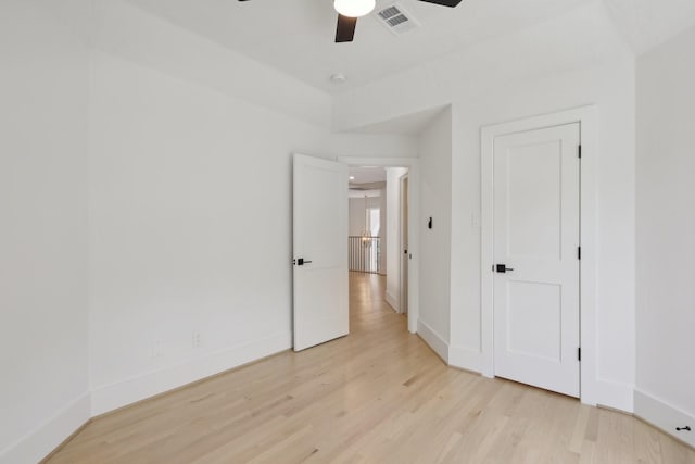 unfurnished bedroom featuring light hardwood / wood-style flooring and ceiling fan