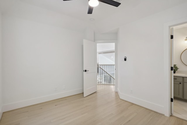 spare room featuring ceiling fan and light hardwood / wood-style floors