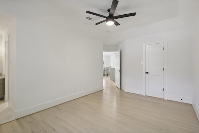 spare room with ceiling fan and light hardwood / wood-style flooring