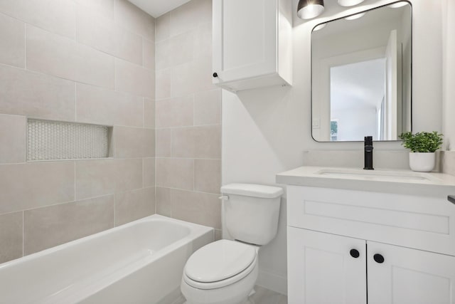 full bathroom featuring vanity, toilet, and tiled shower / bath