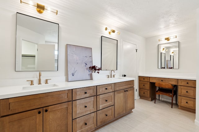 bathroom with vanity and a textured ceiling